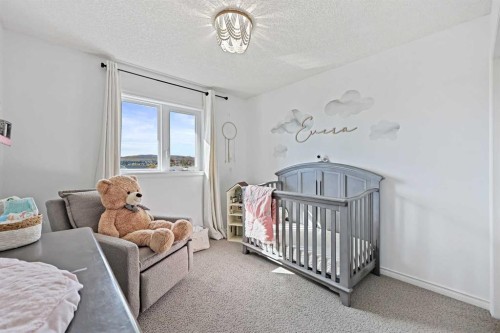 52 West Edge Road, Cochrane, AB - Indoor Photo Showing Bedroom
