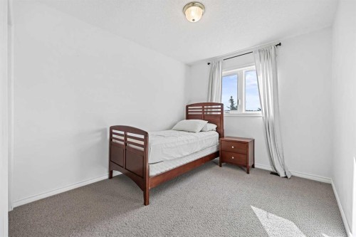 52 West Edge Road, Cochrane, AB - Indoor Photo Showing Bedroom
