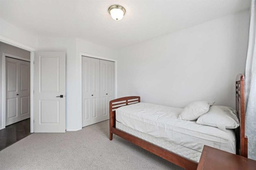 52 West Edge Road, Cochrane, AB - Indoor Photo Showing Bedroom