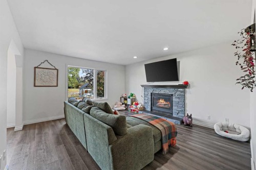 52 West Edge Road, Cochrane, AB - Indoor Photo Showing Living Room With Fireplace