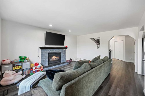52 West Edge Road, Cochrane, AB - Indoor Photo Showing Living Room With Fireplace
