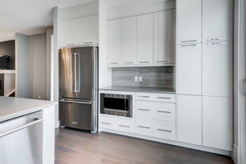 112 Burma Star Road Sw, Calgary, AB - Indoor Photo Showing Kitchen With Stainless Steel Kitchen