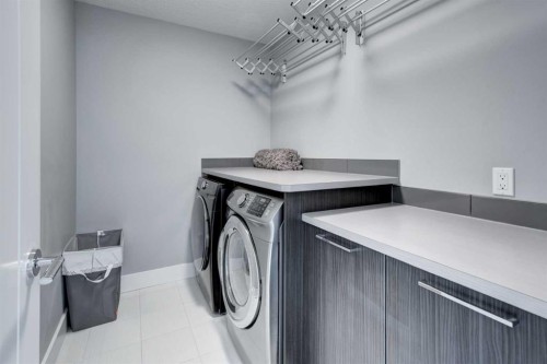112 Burma Star Road Sw, Calgary, AB - Indoor Photo Showing Laundry Room