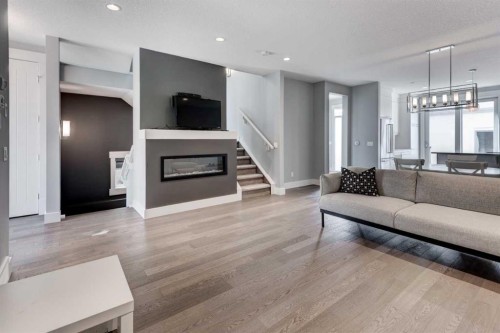 112 Burma Star Road Sw, Calgary, AB - Indoor Photo Showing Living Room With Fireplace