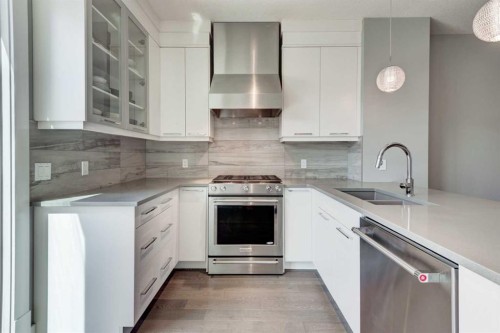 112 Burma Star Road Sw, Calgary, AB - Indoor Photo Showing Kitchen With Stainless Steel Kitchen With Double Sink With Upgraded Kitchen