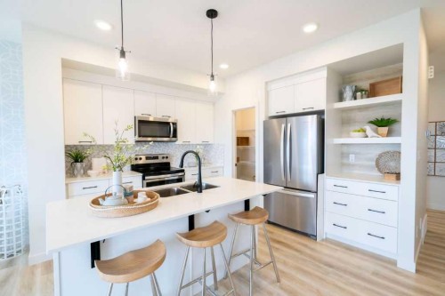 31 Heritage Heath, Cochrane, AB - Indoor Photo Showing Kitchen With Double Sink With Upgraded Kitchen
