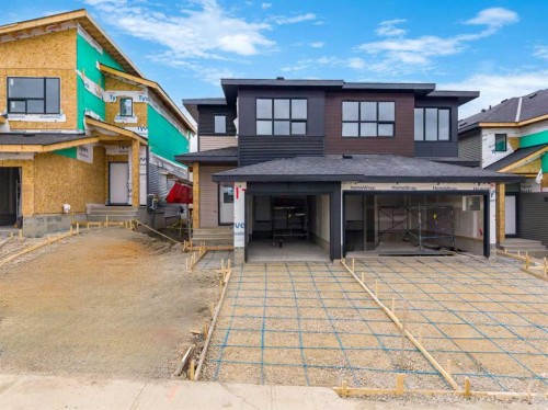 31 Heritage Heath, Cochrane, AB - Outdoor With Facade