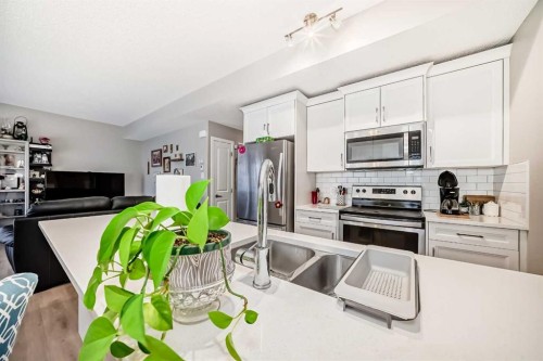 803-250 Fireside View, Cochrane, AB - Indoor Photo Showing Kitchen With Stainless Steel Kitchen With Double Sink With Upgraded Kitchen