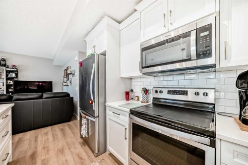803-250 Fireside View, Cochrane, AB - Indoor Photo Showing Kitchen With Stainless Steel Kitchen