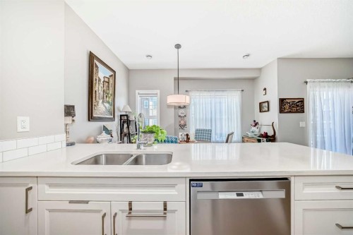 803-250 Fireside View, Cochrane, AB - Indoor Photo Showing Kitchen With Double Sink