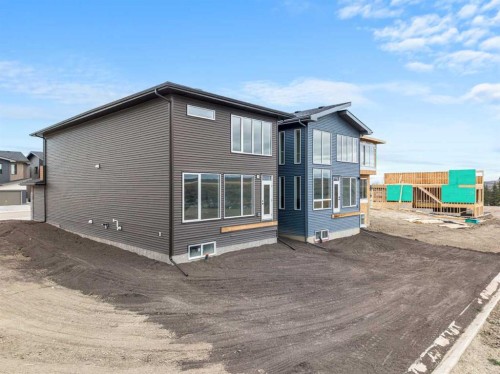 46 Heritage Heath, Cochrane, AB - Outdoor With Exterior