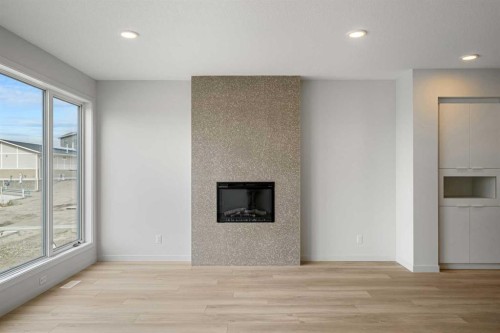 46 Heritage Heath, Cochrane, AB - Indoor Photo Showing Living Room With Fireplace