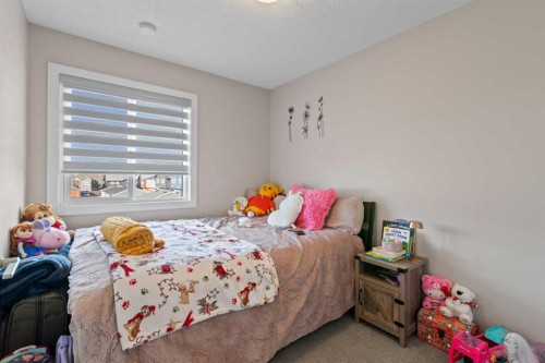 128 Livingston Parade Ne, Calgary, AB - Indoor Photo Showing Bedroom