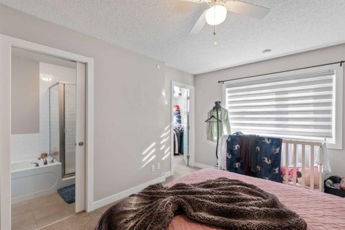 128 Livingston Parade Ne, Calgary, AB - Indoor Photo Showing Bedroom