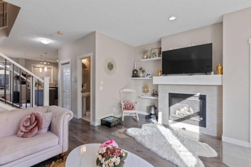 128 Livingston Parade Ne, Calgary, AB - Indoor Photo Showing Living Room With Fireplace