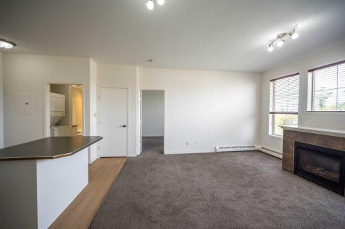310-1000 Applevillage Court Se, Calgary, AB - Indoor With Fireplace
