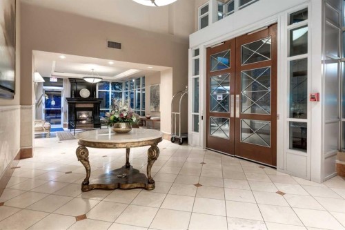 1201-690 Princeton Way Sw, Calgary, AB - Indoor Photo Showing Other Room With Fireplace