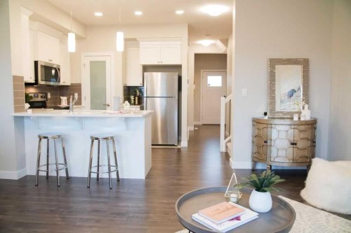 27 Heritage Heath, Cochrane, AB - Indoor Photo Showing Kitchen With Upgraded Kitchen