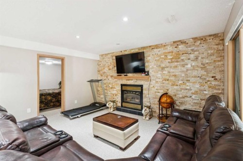26 Mt Robson Close Se, Calgary, AB - Indoor Photo Showing Living Room With Fireplace