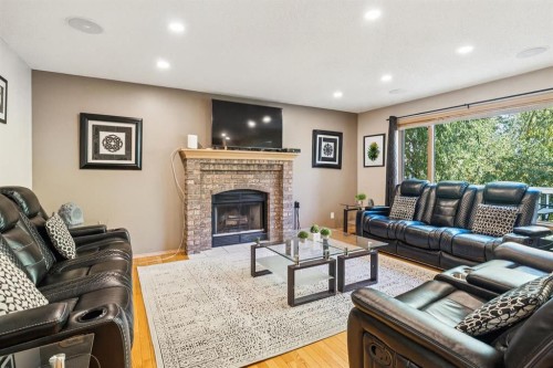 26 Mt Robson Close Se, Calgary, AB - Indoor Photo Showing Living Room With Fireplace