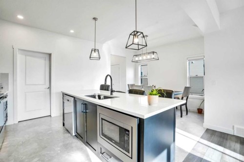 1449 Bayview Point Sw, Airdrie, AB - Indoor Photo Showing Kitchen With Upgraded Kitchen