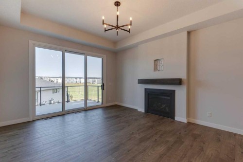 135 Sage Meadows View Nw, Calgary, AB - Indoor Photo Showing Living Room With Fireplace