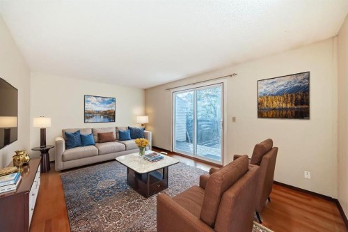 93-6100 4 Avenue Ne, Calgary, AB - Indoor Photo Showing Living Room
