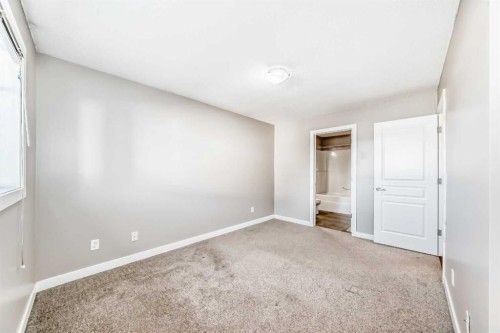 33 Cimarron Vista Gardens, Okotoks, AB - Indoor Photo Showing Other Room