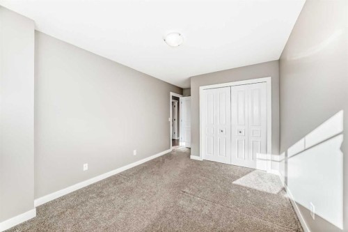 33 Cimarron Vista Gardens, Okotoks, AB - Indoor Photo Showing Other Room