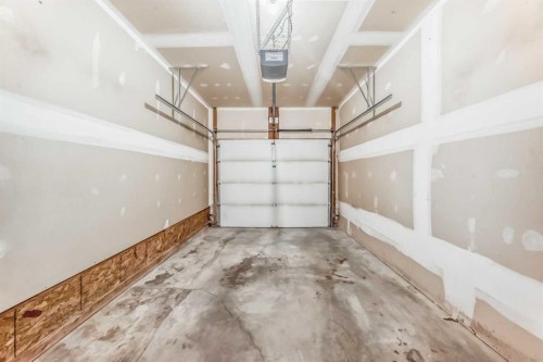 33 Cimarron Vista Gardens, Okotoks, AB - Indoor Photo Showing Garage