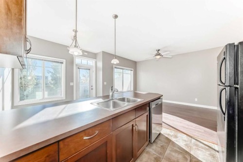 33 Cimarron Vista Gardens, Okotoks, AB - Indoor Photo Showing Kitchen With Double Sink