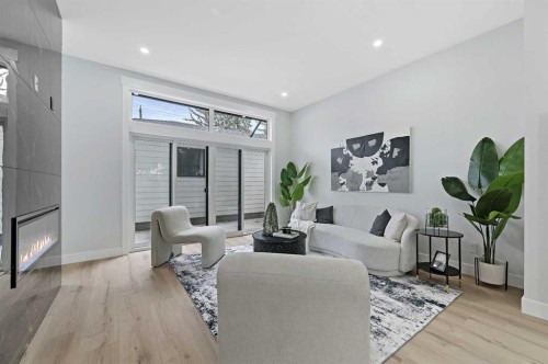 107 Hartford Road Nw, Calgary, AB - Indoor Photo Showing Living Room With Fireplace