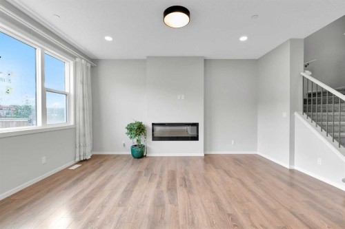 106 Lucas Crescent Nw, Calgary, AB - Indoor Photo Showing Living Room With Fireplace
