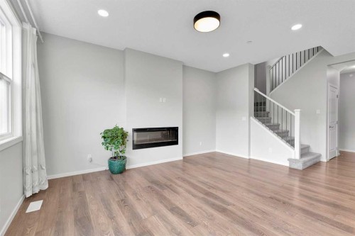 106 Lucas Crescent Nw, Calgary, AB - Indoor Photo Showing Other Room With Fireplace