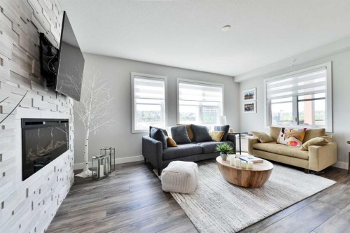 415-8355 19 Avenue Sw, Calgary, AB - Indoor Photo Showing Living Room With Fireplace
