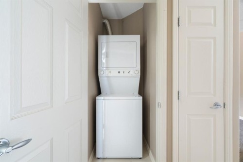 4214-92 Crystal Shores Road, Okotoks, AB - Indoor Photo Showing Laundry Room