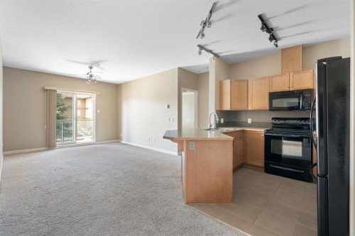 4214-92 Crystal Shores Road, Okotoks, AB - Indoor Photo Showing Kitchen