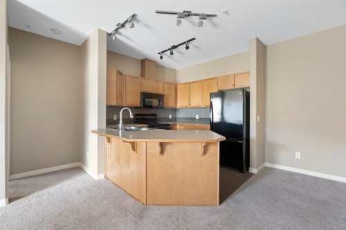 4214-92 Crystal Shores Road, Okotoks, AB - Indoor Photo Showing Kitchen