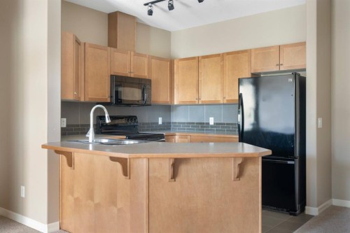 4214-92 Crystal Shores Road, Okotoks, AB - Indoor Photo Showing Kitchen