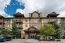 4214-92 Crystal Shores Road, Okotoks, AB  - Outdoor With Balcony With Facade 