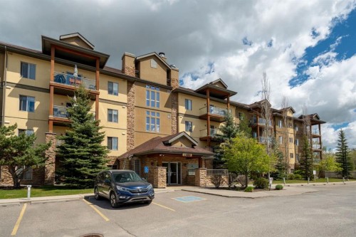 4214-92 Crystal Shores Road, Okotoks, AB - Outdoor With Balcony With Facade