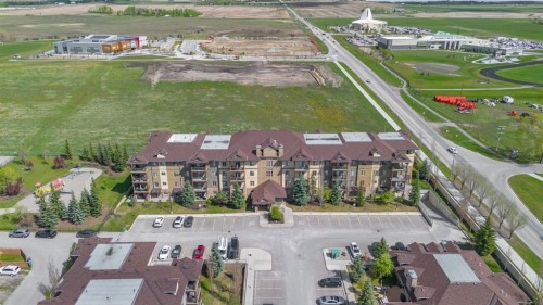 4214-92 Crystal Shores Road, Okotoks, AB - Outdoor With Body Of Water With View