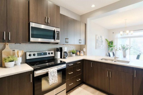 271 River Heights Crescent, Cochrane, AB - Indoor Photo Showing Kitchen With Stainless Steel Kitchen With Double Sink With Upgraded Kitchen