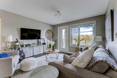 210-5029 Edgemont Boulevard Nw, Edmonton, AB - Indoor Photo Showing Living Room