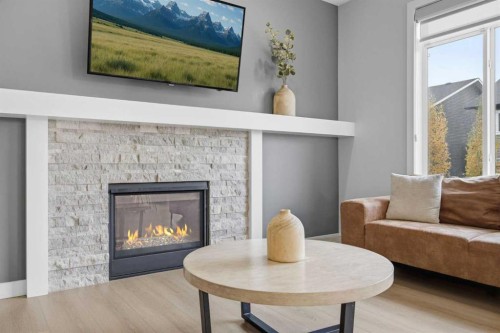 520 Kingsmere Way Se, Airdrie, AB - Indoor Photo Showing Living Room With Fireplace