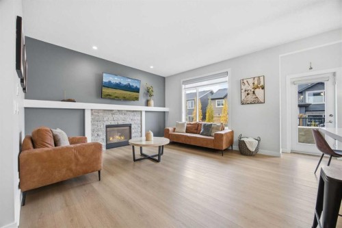 520 Kingsmere Way Se, Airdrie, AB - Indoor Photo Showing Living Room With Fireplace