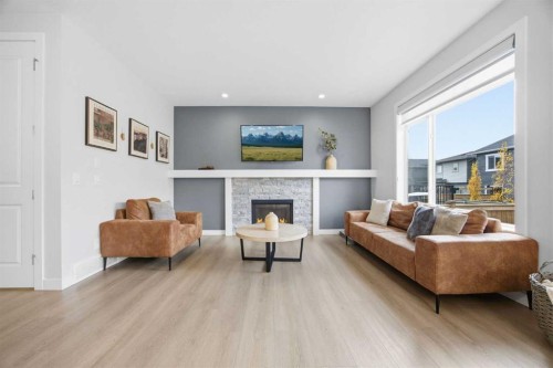520 Kingsmere Way Se, Airdrie, AB - Indoor Photo Showing Living Room With Fireplace