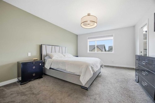 520 Kingsmere Way Se, Airdrie, AB - Indoor Photo Showing Bedroom