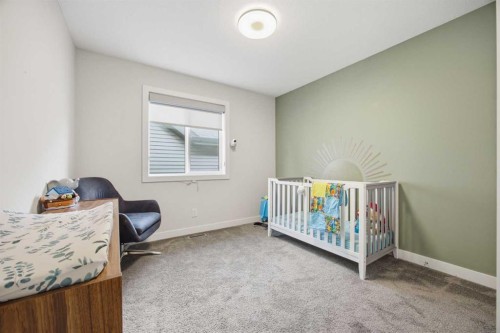 520 Kingsmere Way Se, Airdrie, AB - Indoor Photo Showing Bedroom