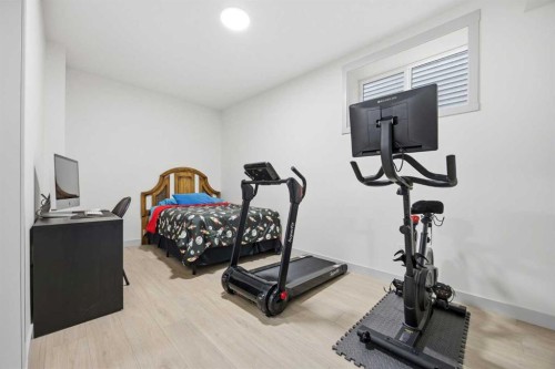 520 Kingsmere Way Se, Airdrie, AB - Indoor Photo Showing Gym Room